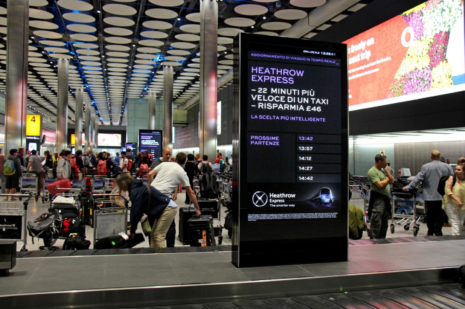 Advertising wrap on a baggage reclaim carousel in an airport arrivals hall
