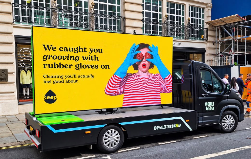 Seep AdVan on Regent Street in London, its screen showing 'Cleaning you'll actually feel good about', with the Antler storefront visible behind