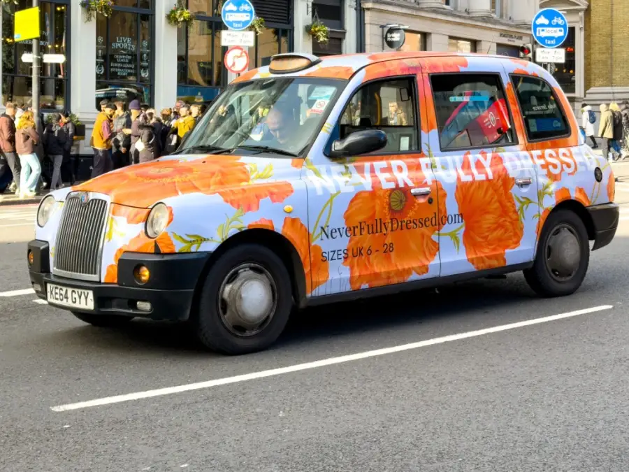 A London taxi with a full floral advertising livery